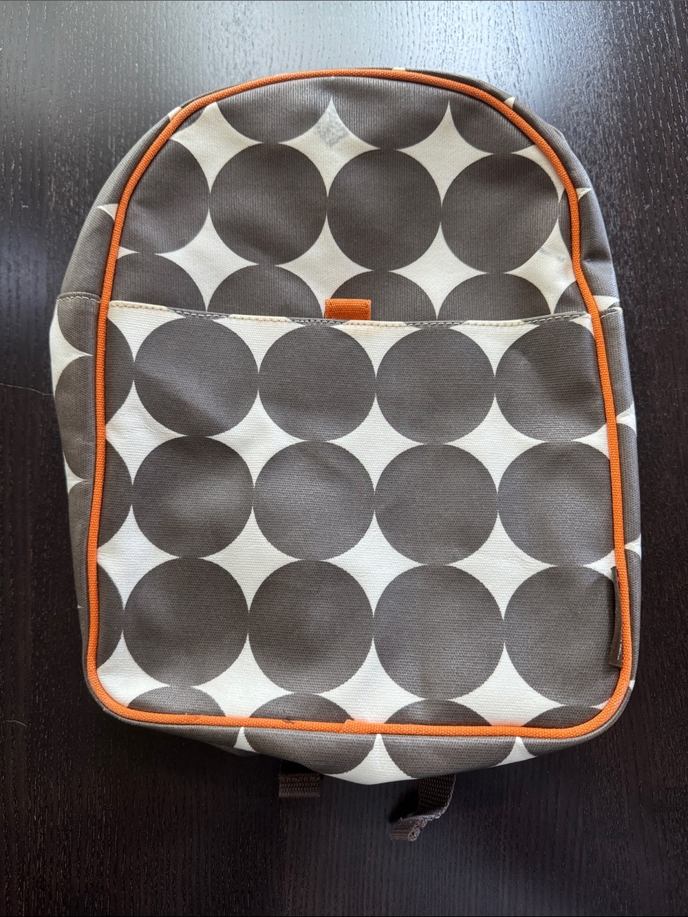 Dwell Studios Kids Circle Pattern Backpack in Brown and Orange waxed fabric.